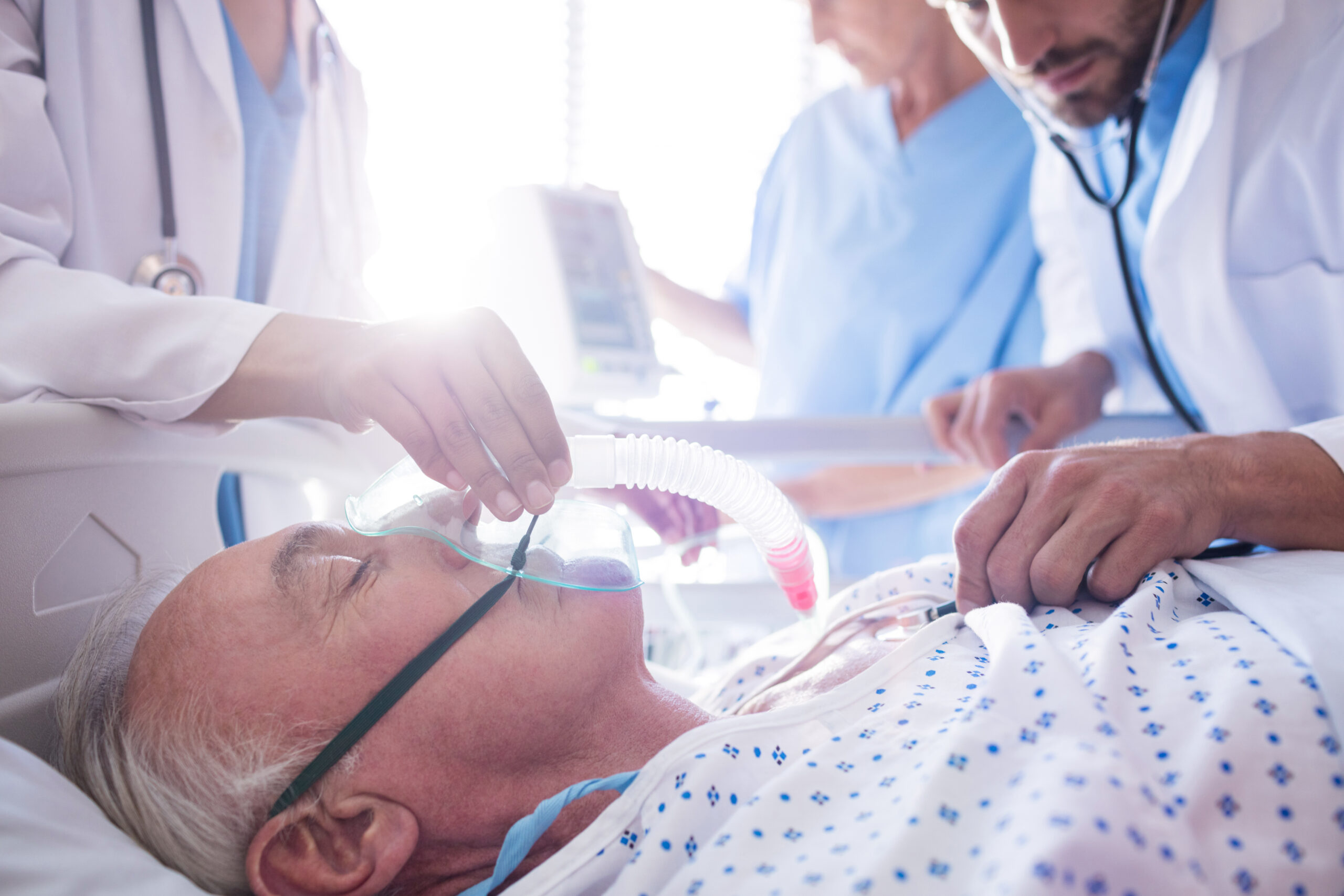 Doctors providing emergency care with oxygen mask to patient illustrating emergency medicine career for Indian professionals